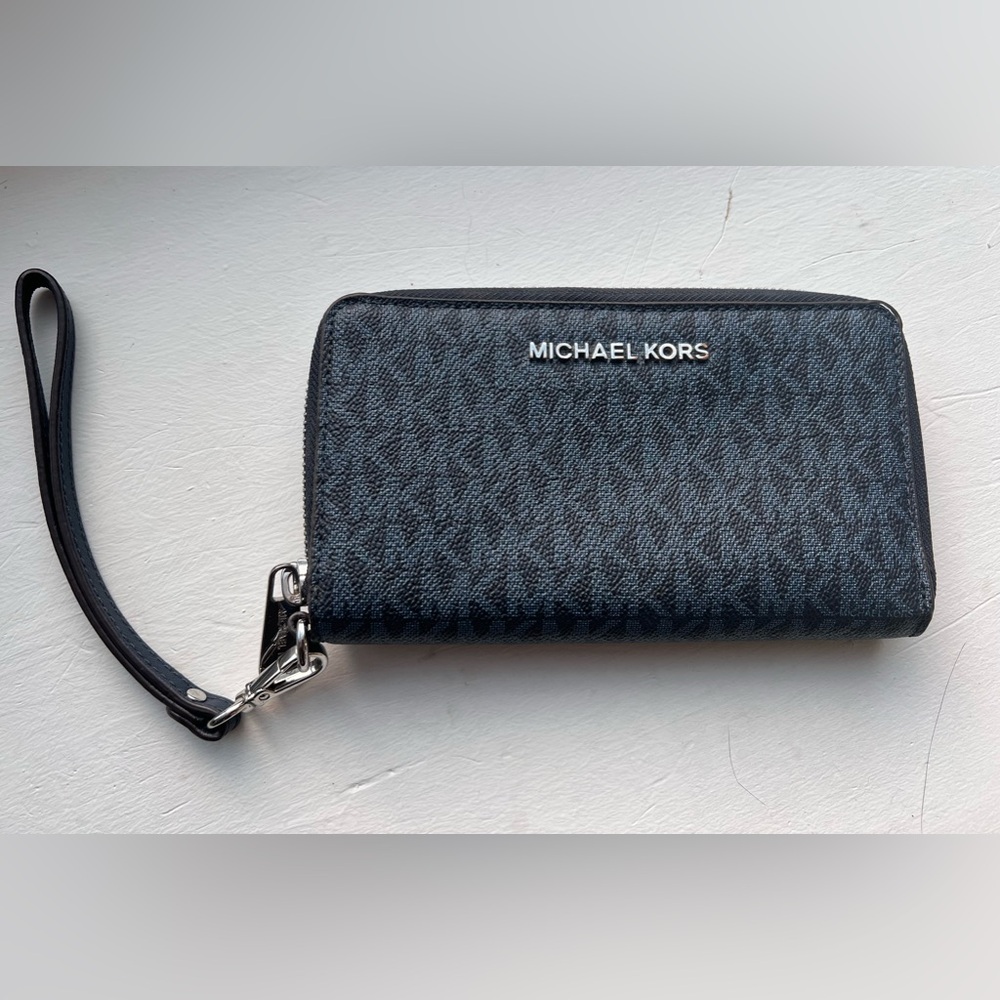 Michael Kors wristlet. NWOT Deep blue with blue logo. Matching laptop in closet!